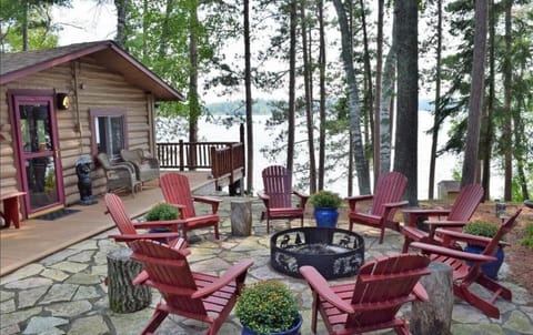 Fire Pit Over Looking Lake and Large Pines with Grilling Area