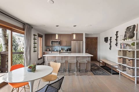 Start the day with coffee and mountain plans around a dining table made for shared meals and conversation.