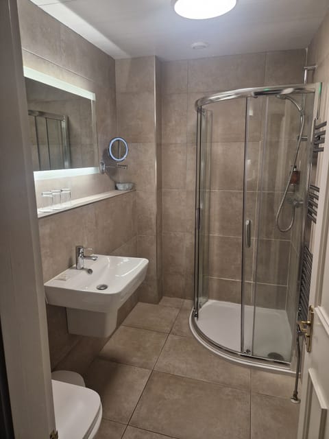 Shower, rainfall showerhead, eco-friendly toiletries, hair dryer