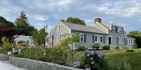 Main house, a garden of many hydrangeas and a very well manicured yard