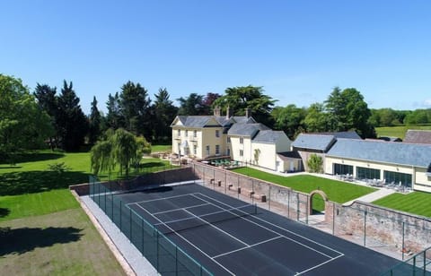Tennis court, indoor pool, hot tub and large gardens