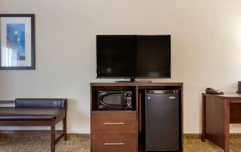 Premium bedding, desk, laptop workspace, blackout drapes