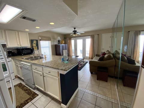 Relax in our spacious living room with a sofa sleeper couch, TV and balcony door