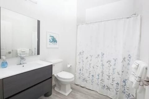 Spacious ADA-compliant bathroom with shower/tub combo for a refreshing or relaxing experience.