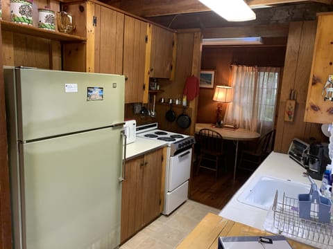 The kitchen has a new stove and new flooring. It is fully equipped.