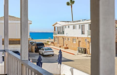 Peek-a-boo ocean view from the front balcony, just steps from the beach
                