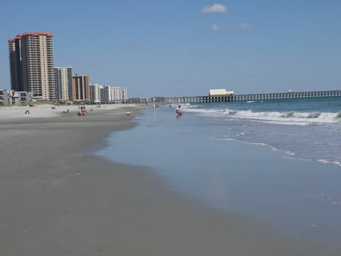 View walking north along the beach towards the Apache pier