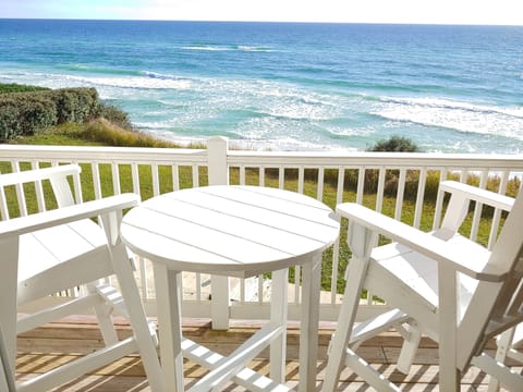 Family room balcony view. Seating for 4. Steps from balcony lead to beach steps