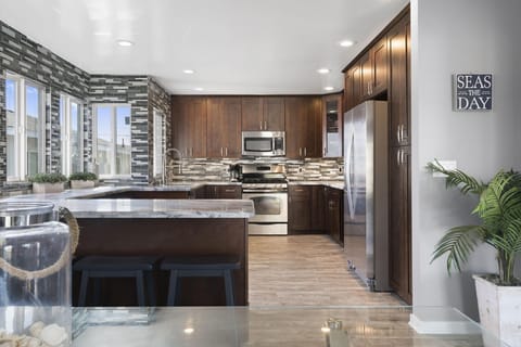 Modern main house kitchen is fully-stocked with dishes, cooking, baking and meal prep gear. All standard large and small appliances included. See listing description for more supply details.