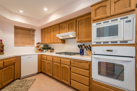 Kitchen fully stocked with everything a cook would need.  