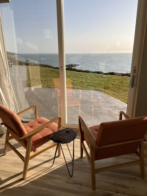 Master bedroom private area w/ view seating, fireplace and tv.