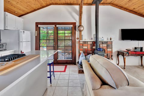 French doors go to patio off of kitchen and living room. Wood burning stove.