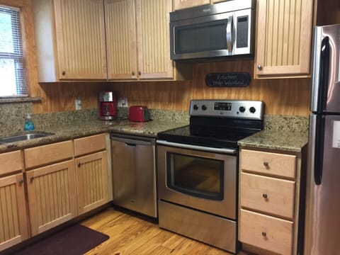 Kitchen has lots of storage, including a separate pantry.