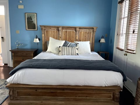 Spacious and serene bedroom featuring a king-sized bed with luxurious linens.