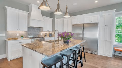 Full-sized Refridgerator and Freezer stocked with condiments