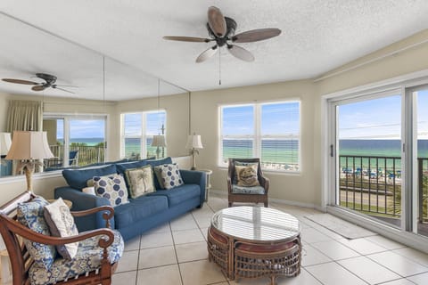 Relax on the sofa with corner windows framing the Gulf.