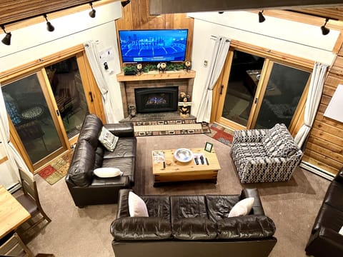 Looking down from the Loft at the TV and fireplace in the living room.