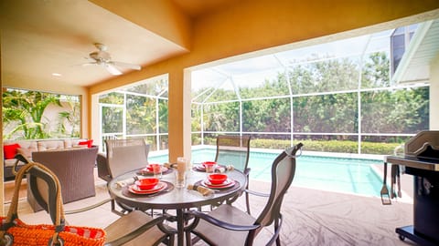 Outdoor eating by the heated pool  - including a grill.