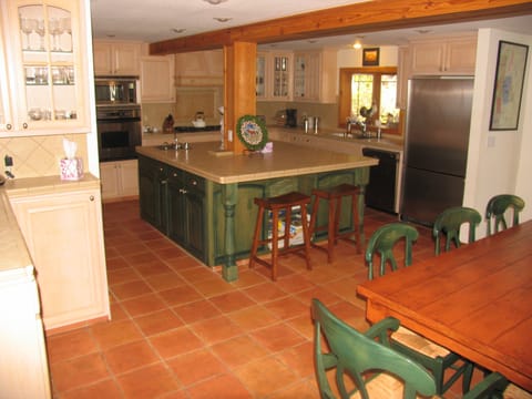 Large kitchen and dining area.  Two dishwashers, prep sink, trash compactor
