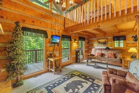 open concept living room with gas fireplace