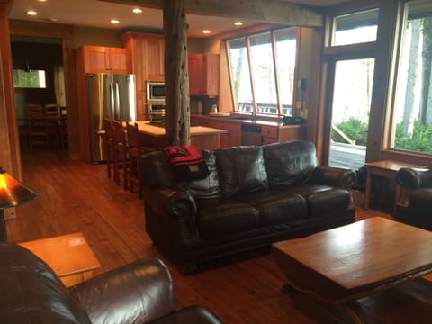 Open floor plan - living room/kitchen/dining with water-view