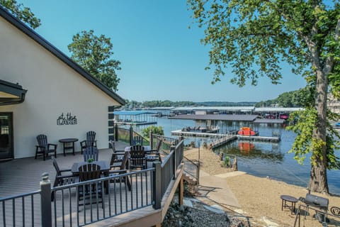 Expansive lake views from deck seating, perfect for dining or lounging.
