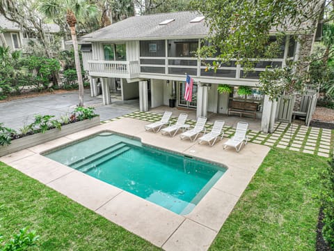 2 living rooms, private baths for each bedroom, large screened porch, pool & "tanning ledge"
