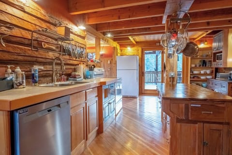 Kitchen with patio doors leading to large covered deck