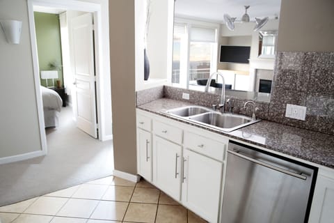 Kitchen and bar with modern appliances and stunning waterfront views.