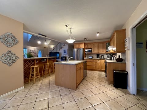 Open plan kitchen with breakfast bar. 