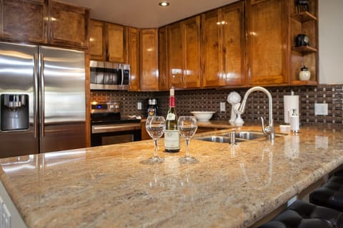 Kitchen with new granite, cabinets and SS appliances
