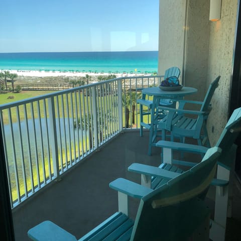 Both living area and master lead to balcony.