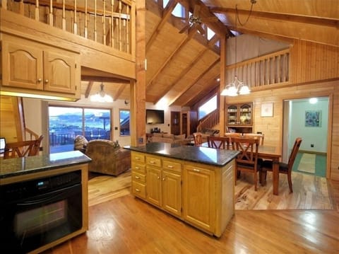 View from the kitchen. Living room in rear. Laundry & bath through door on right