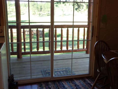 Out the door of the cabin.