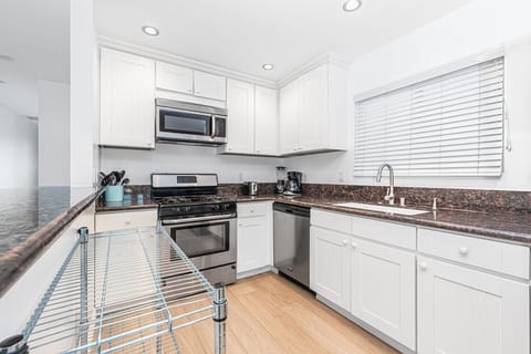 The kitchen comes stocked with gear for meal prep and dining (dishes, glassware, flatware, cookware, bakeware, etc.), as well as small and major appliances.
                