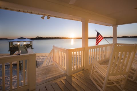 Enjoying another sunset on our porch with a glass of wine in hand :)