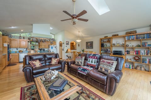 Relax in the huge, comfy living room & enjoy one of many hard back books.