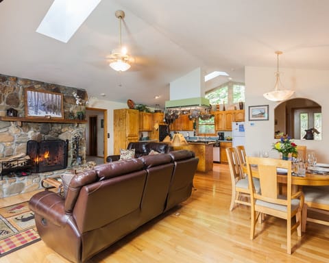 Open floor plan with wood burning fireplace dining and superbly equipped kicthen
