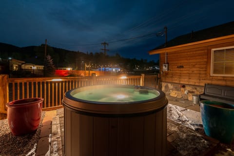 A private 4-person hot tub with views of the Rocky Mountains