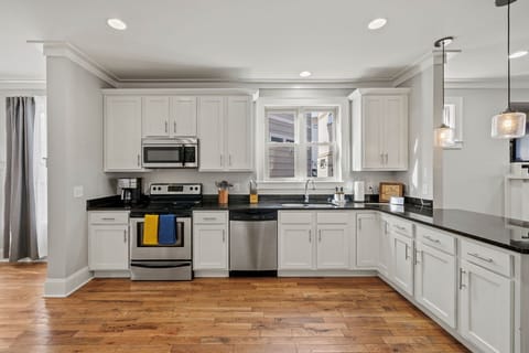 Big well stocked kitchen with plenty of counter space.