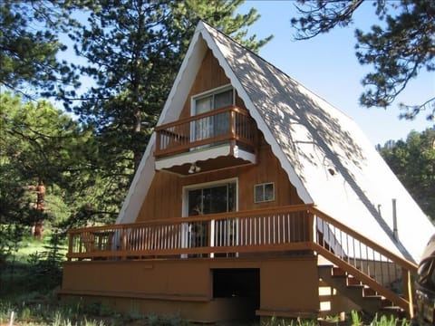 Outside front view of the A-Frame. Charm and comfort nestled in the woods!