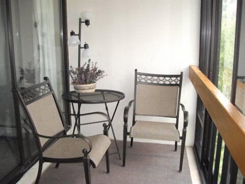 Enjoy coffee and mountain views on the enclosed patio.