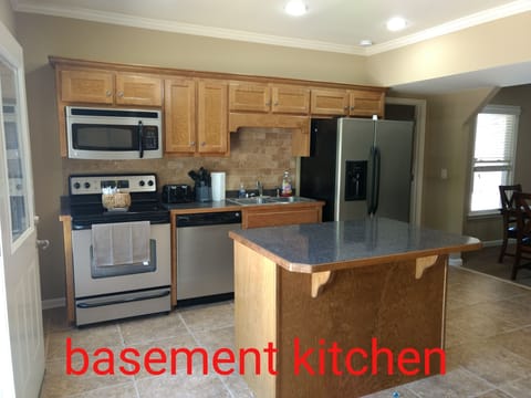 basement kitchen with stainless appliances