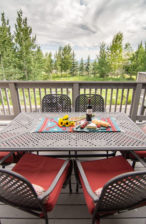 Large deck with large gas grill for grilling or relaxing.