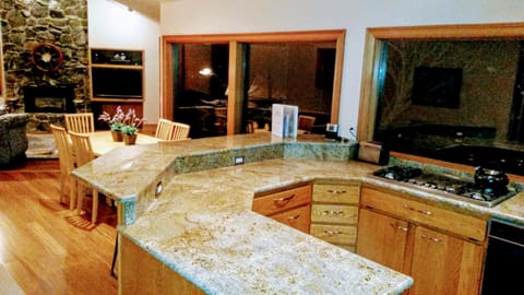 view from Kitchen to the living room fireplace and entertainment center