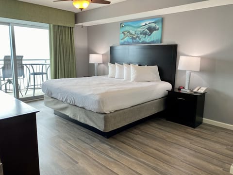 Updated master, king bed, attached bath and access to balcony. 