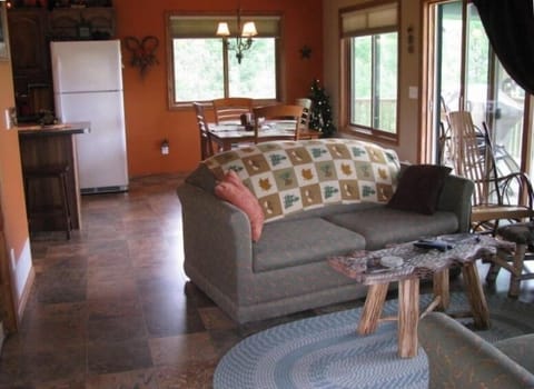 Living Dining area. Patio doors go to 10 X 24 deck overlooking the lake.