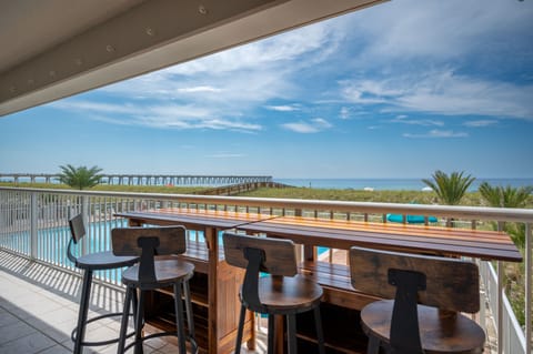 Positioned just over the pool deck.