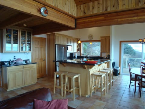 The kitchen island seats 5 and is a fun place to gather and watch the cook.
