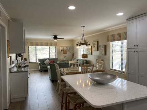 Totally renovated kitchen with all new appliances, island, and luxury flooring